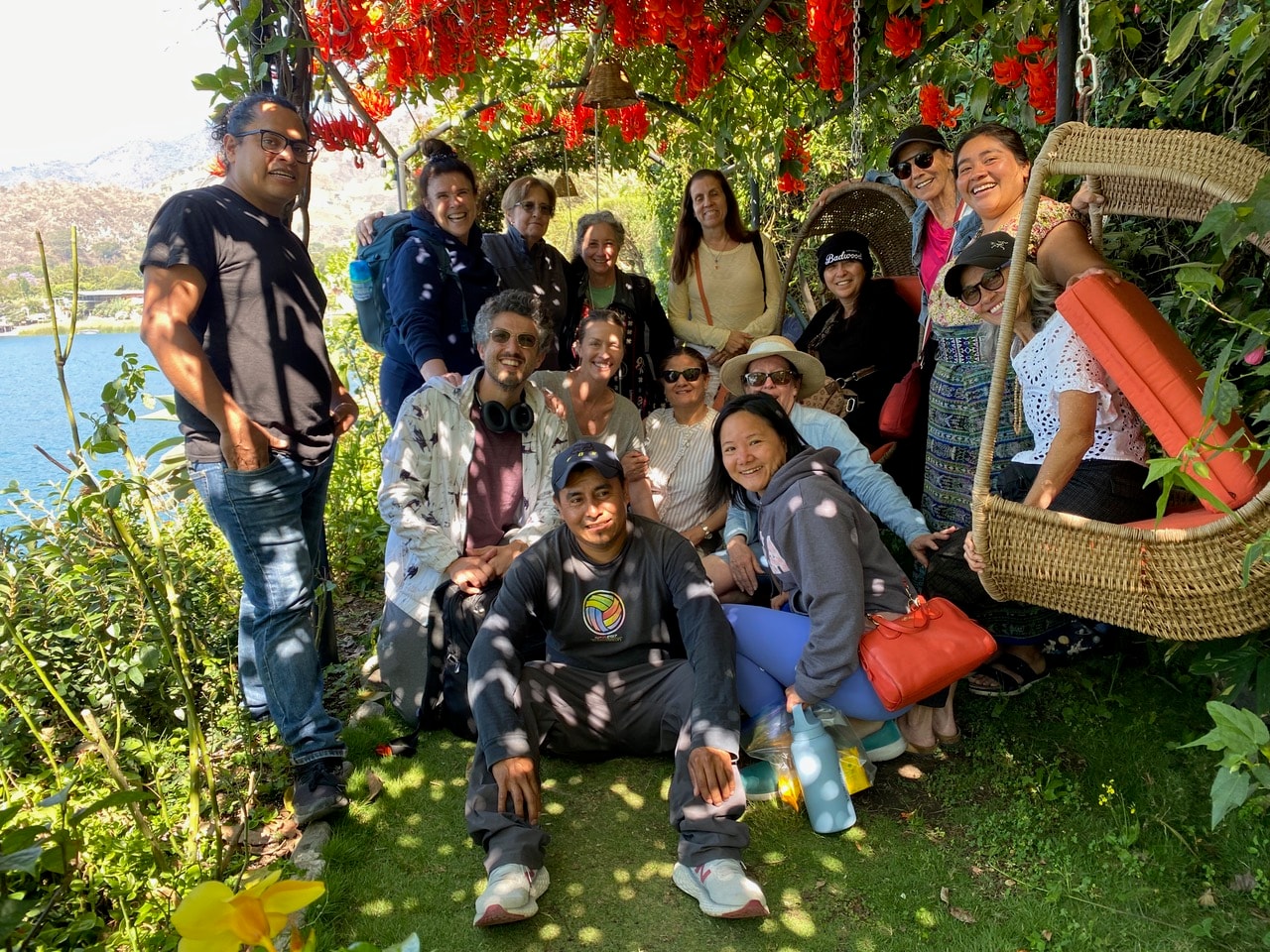 A group of friends gathered together in a lush garden